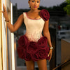 Elegant Ivory Dress With Red Embellishments And Large Rose Accents On Skirt And Shoulder Exudes Glamour And Sophistication Perfe