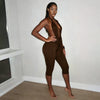 Solid color neck tie, knot, exposed back, tight fitting jumpsuit, cropped pants