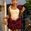 Elegant Ivory Dress With Red Embellishments And Large Rose Accents On Skirt And Shoulder Exudes Glamour And Sophistication Perfe