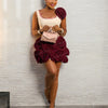 Elegant Ivory Dress With Red Embellishments And Large Rose Accents On Skirt And Shoulder Exudes Glamour And Sophistication Perfe